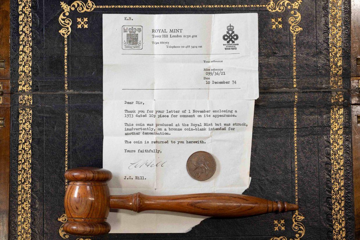 Error 1973 10p With Letter - 1973 large-sized UK 10p coin, struck in bronze alloy, rather than cupronickel, accompanied by a 10 December 1974-dated letter from The Royal Mint, confirming the wrong planchet error. Error 1973 10p With Letter - 1973 large-sized UK 10p coin, struck in bronze alloy, rather than cupronickel, accompanied by a 10 December 1974-dated letter from The Royal Mint, confirming the wrong planchet error.