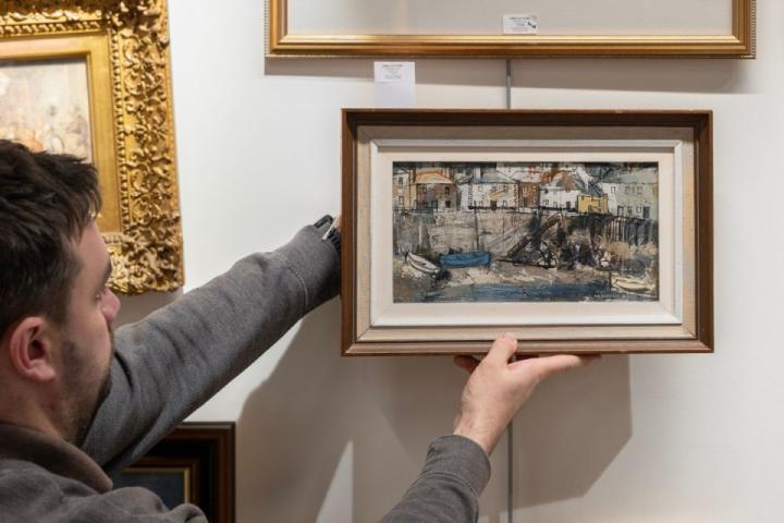 George Hammond Steel (British, 1900-1960), oil on board of Mousehole harbour at low tide, signed lower right. Sold at RWB Auctions in January 2026.